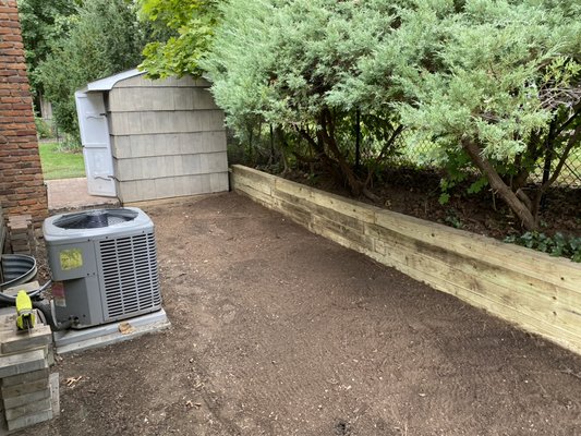 Retaining wall and graded