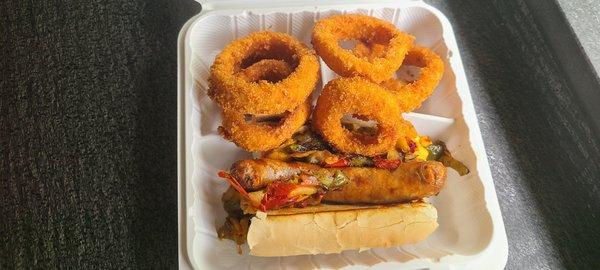 Sausage, pepper and onion sandwich w/ onion rings.