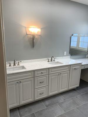 Bathroom Remodel
 Paint Color Sherwin Williams Gray Clouds with a Satin Finish, Custom Solid Wood Vanity in Glacier and Quartz Top.