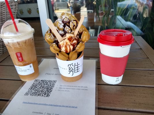 Milk foam Earl gray tea (left), matcha egg waffle with vanilla ice cream (center), hot Matcha green latte