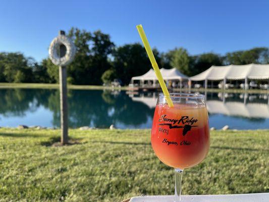 Strawberry and peach slushee (vodka-based) swirl by the pond