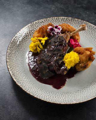 Confit duck leg- black truffle - red plum merlot reduction- cauliflower tempura