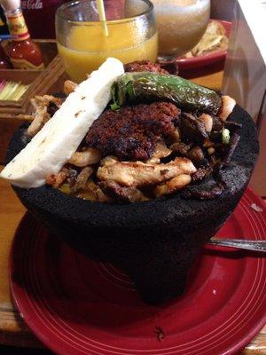 Molcajete! Combination of everything! Beef and chicken fajitas, shrimp, chorizo and cheese.