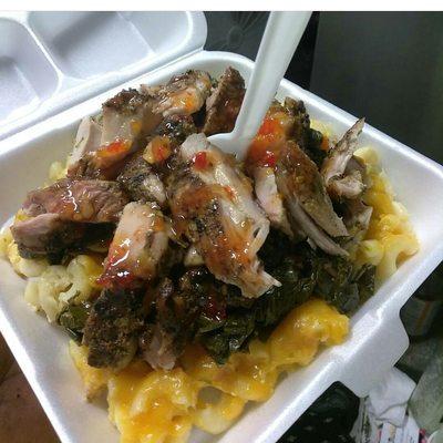 Boneless jerk chicken with collards and Mac n cheese