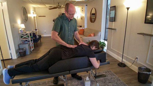 Dr. Jason working with a practice member with the use of a pregnancy bolster.