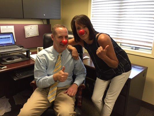 Supporting kids with red nose day at the office.