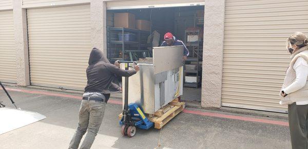 We specialize in moving heavy items.  In this picture we are moving a commercial gas range stove & oven.