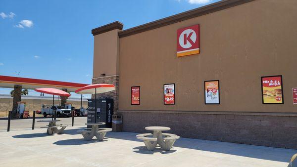 Picnic tables on the west side of store. One is designed for handicapped access.