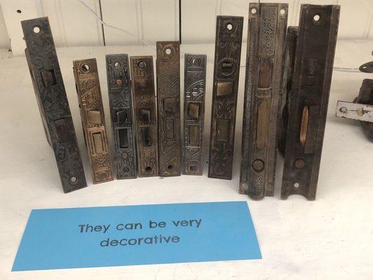 A display of vintage lock faceplates in the museum section.