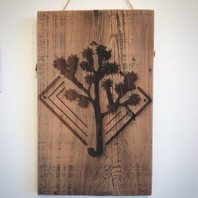 Our J Tree Artery signature piece of art. Each piece is laser etched into reclaimed redwood salvaged from the desert.