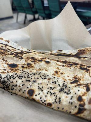 Hot, freshly made bread with black sesame seeds.