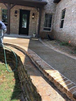 Brick boarder and exposed aggregate front patio