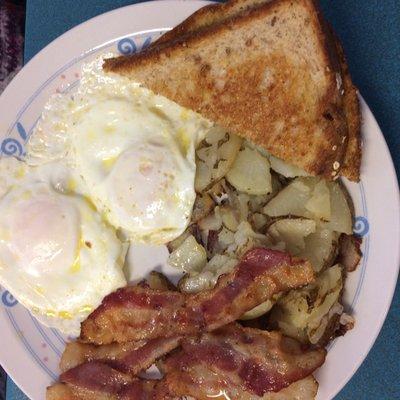 2 eggs with home fries, toast, & bacon