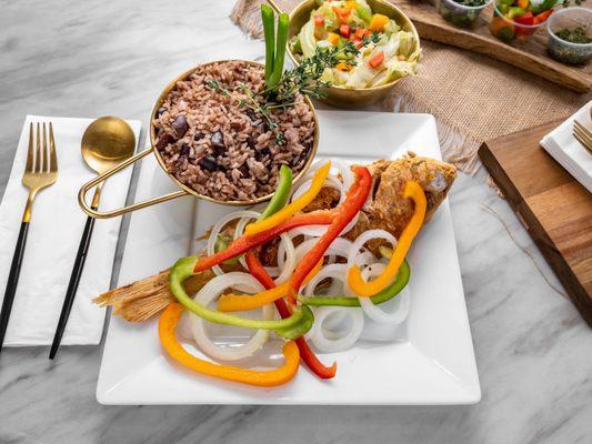 Fried Whole Red Snapper with escovitch served
With Rice&Peas and cabbage