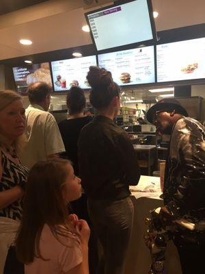 The blond woman there with the little girl was the one who had been waiting over half an hour for a Sprite and a medium fry.