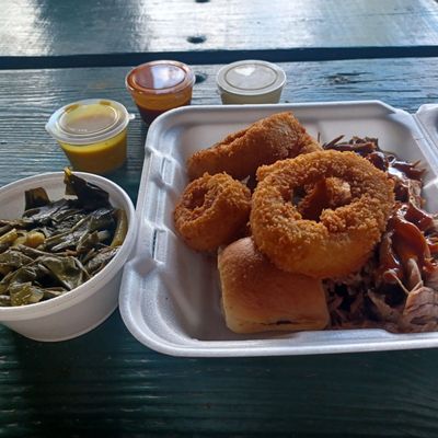 Pulled pork, onion rings and collard greens.