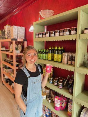 Abby (customer) shopping around The Pearl Plate and sipping on delicious chai made using in-store chai concentrate.