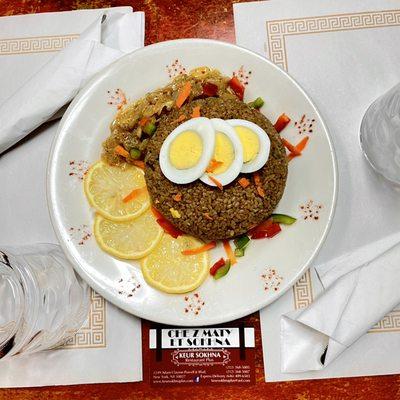 Our famous brown jollof rice, simmered with vegetables