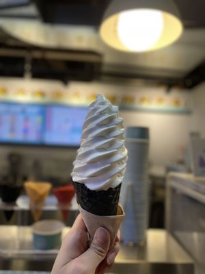 Vanilla soft serve on chocolate waffle cone