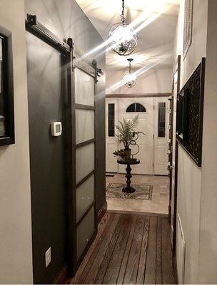 Hallway with new barn door and accent wall