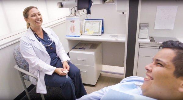 Dr. Lindsay Davidson having a good laugh with her patient.