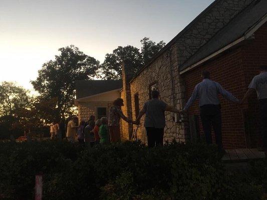 Praying around church before demolition