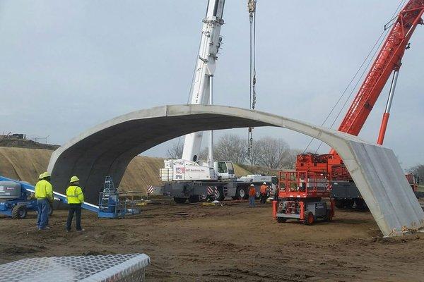 SDV Services, Inc. performs crane, rigging and installation of pre-cast concrete members for a highway underpass in the San Joaquin Valley.