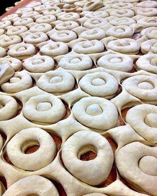 1200 order of glazed donuts being prepped