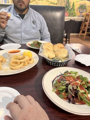 Calamari (halfway gone), bread, salads with house dressing