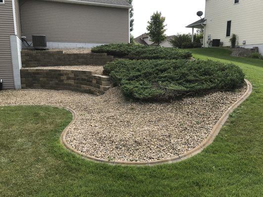 After- leaning retaining wall re-build.