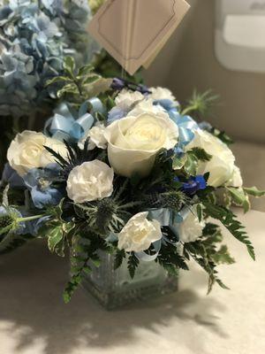 Baby brother's arrangement in blue glass block.