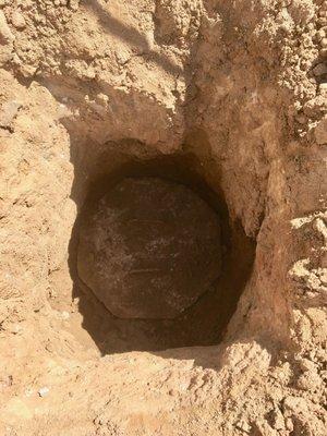 The concrete lid 2.5' down, covering the first of the two septic tank openings