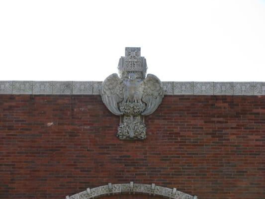 The cornice ornament represents "Old Abe," an eagle that served as the mascot of Wisconsin's Civil War 8th Infantry Regiment.