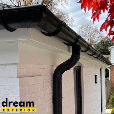 Black gutter and downspout installation