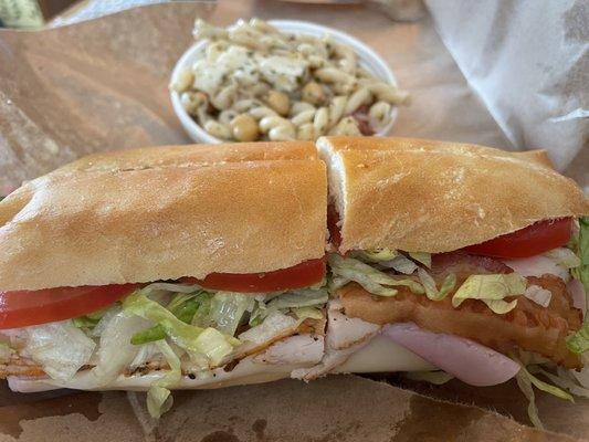 Half club sandwich with pasta salad