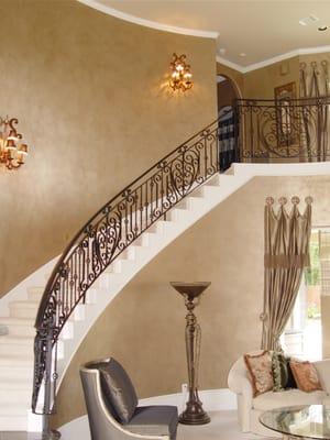 Two story foyer with soft metallic faux finish