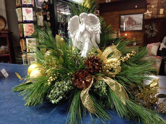 A gorgeous centerpiece with an Angel in the middle.