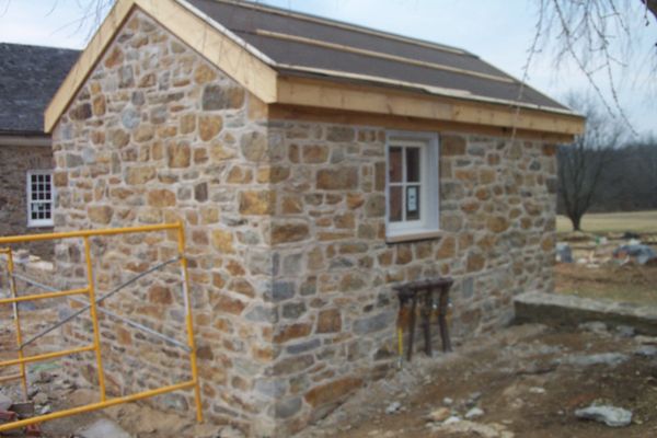 Field stone garden shed.