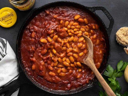 Baked Beans A rich, hearty blend of slow-cooked beans in a sweet, tangy sauce that perfectly complements your BBQ feast.