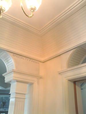 Victorian Foyer- coped bead board ceiling fluted columns, beaded arched transom.