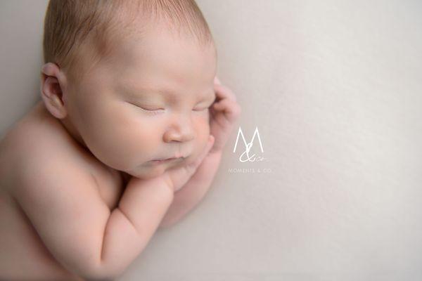 Baby sleeping on hands