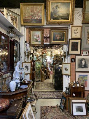 View of the interior of A Galerie, displaying art, statue work, & flow of the space.