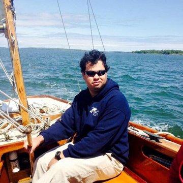 Captain Nathan on the waters of Casco Bay, ready to host your customized sailing excursion in Portland, Maine.