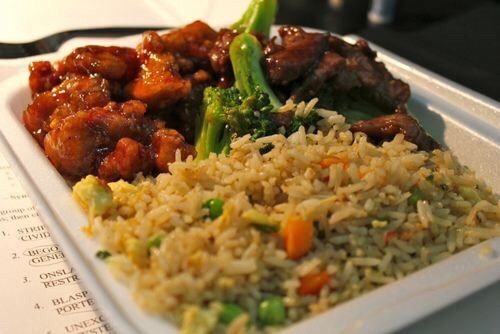 A combo of sesame chicken with veg fried rice