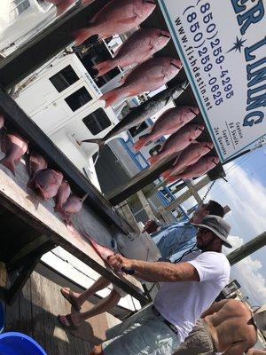 Jake cleaning our catch for the day.