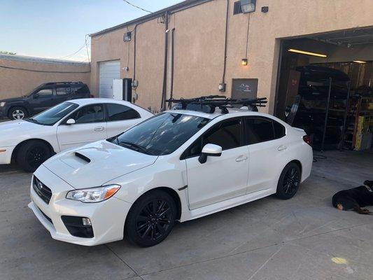 2017 Subaru WRX with Custom Yakima Jetstream sysytem and 2 Rockymounts Brasskuckles