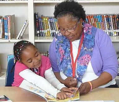 Many volunteers say reading to their student is the highlight of their week.