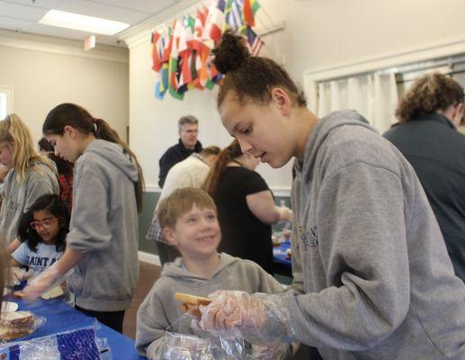 Saint Ann participate in social justice and charitable activities. Lenten sandwich making turns 1000 sandwiches for Arlington Homeless.