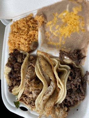 Fajita, Carnita, Fish and Barbacoa Tacos with rice and beans.