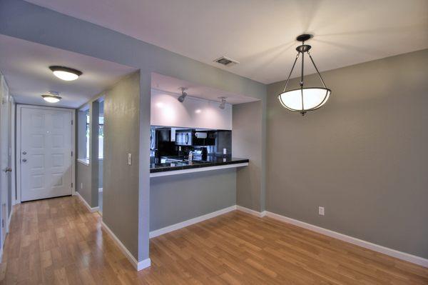 Listing photo of family room and kitchen.